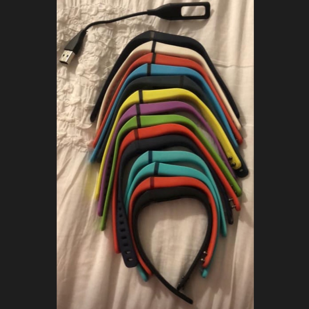 Fitbit Flex bands and charging cord.